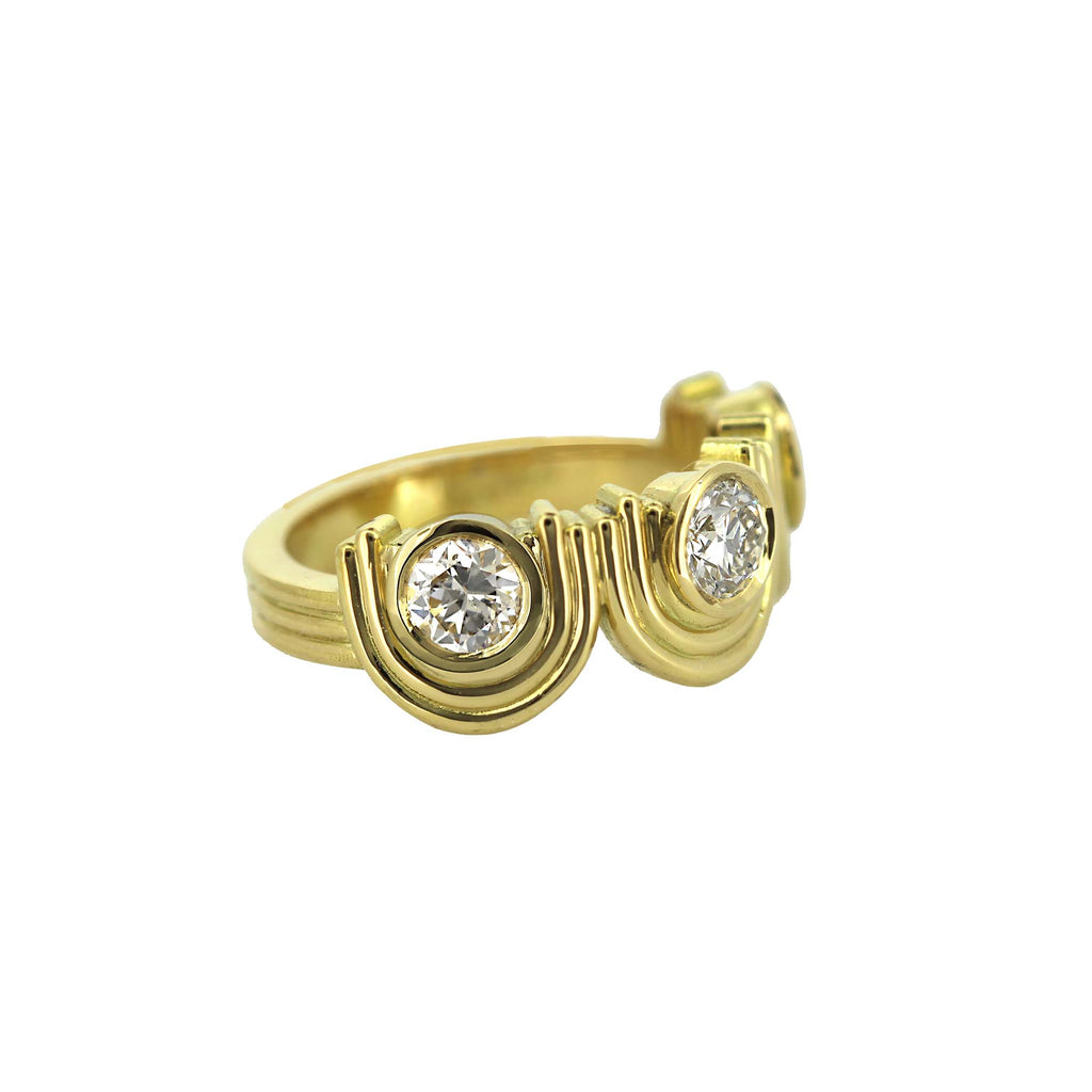 art deco inspired diaond ring with three diamonds set into Arches pattern 