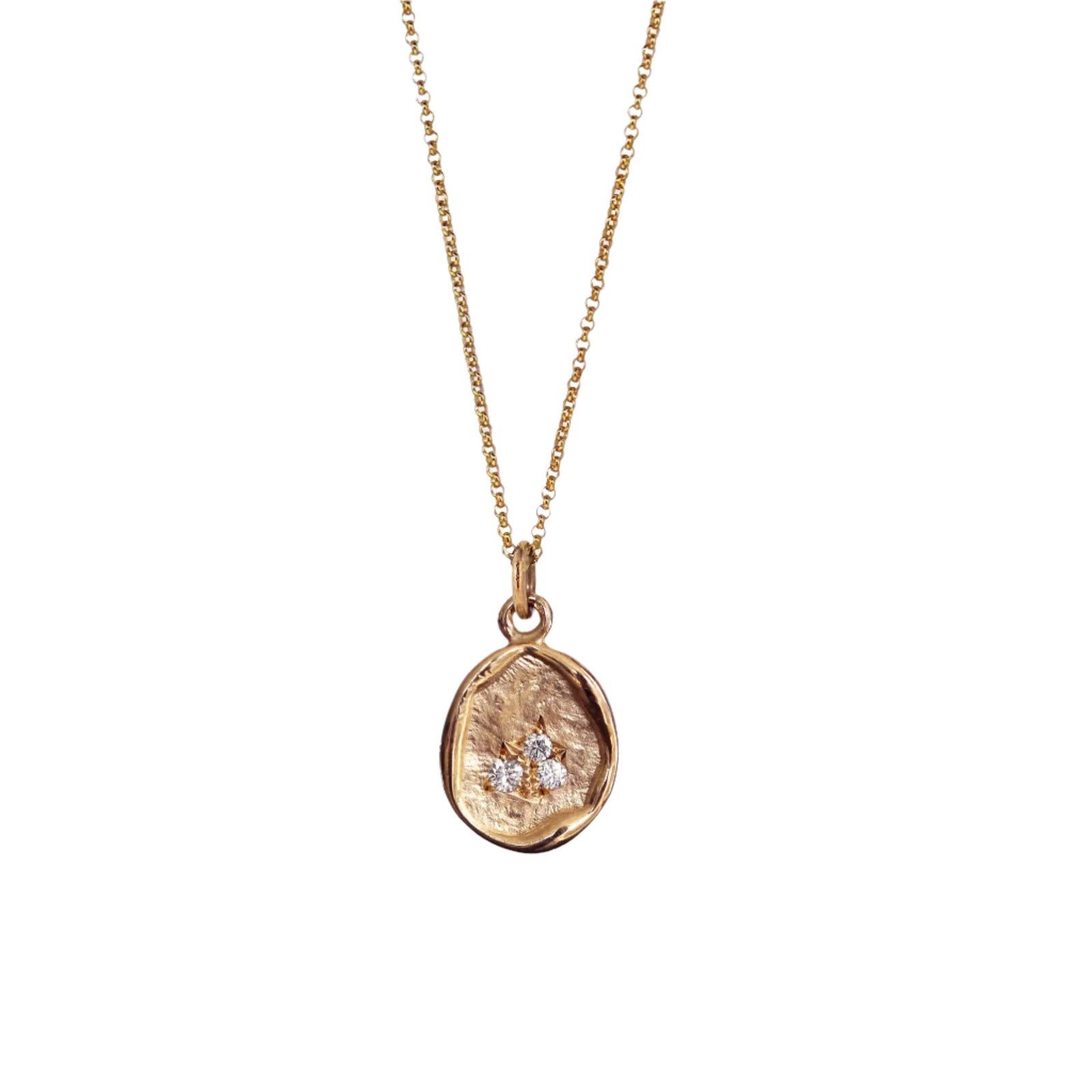Organic oval rose gold pendant on rose gold chain with 3 grain set diamonds