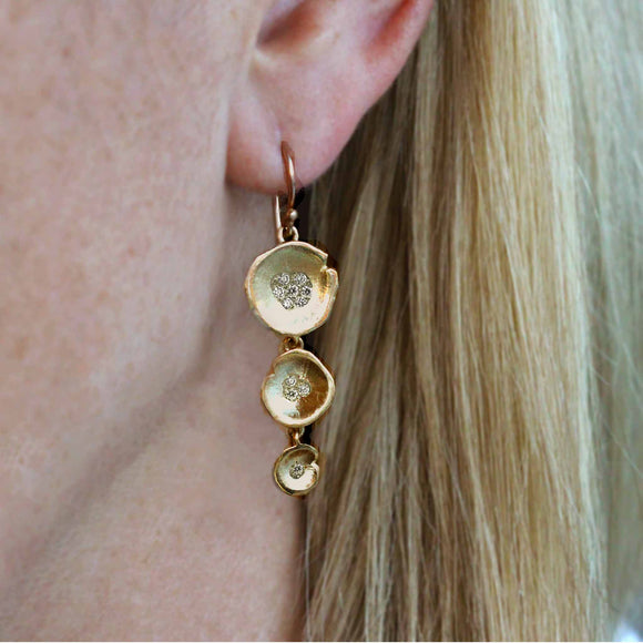 Long Lilypad diamond drop earrings . Tiered yellow gold drop earrings accented with diamonds