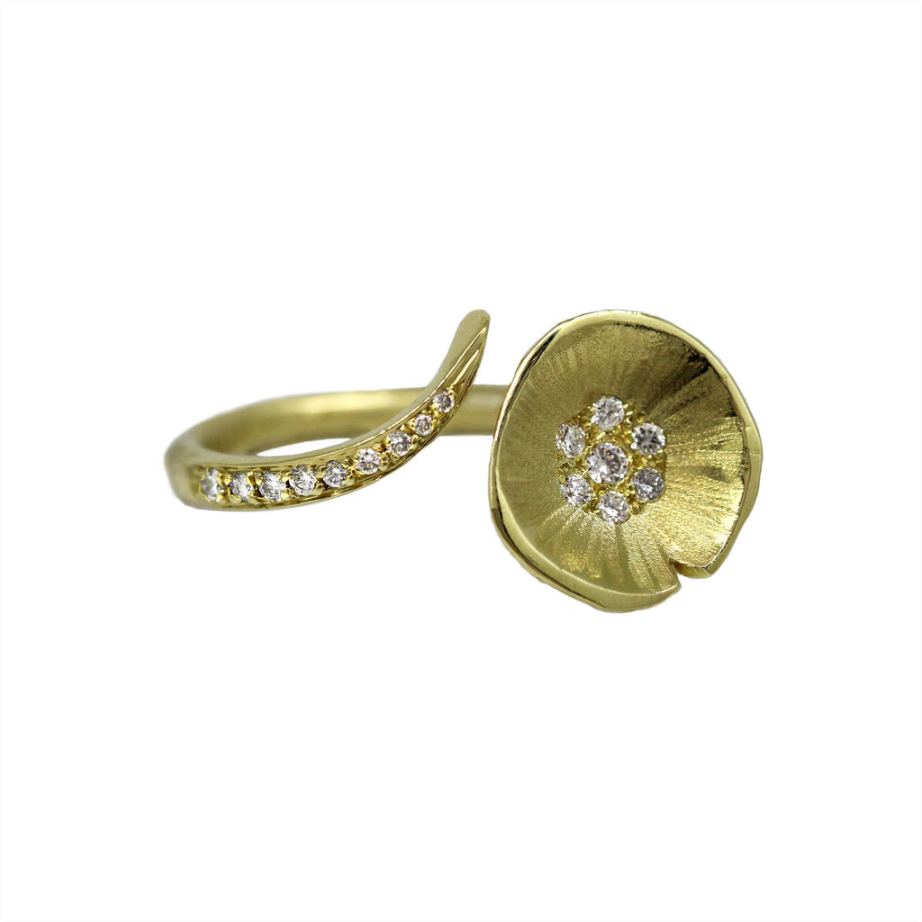 gold and diamond lily pad floating ring has diamond set lilypad on an open band