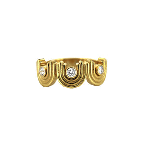 Three bezel set diamonds in a yellow gold art deco inspired ring