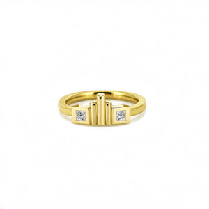 Gold ring with diamond accents on a white background