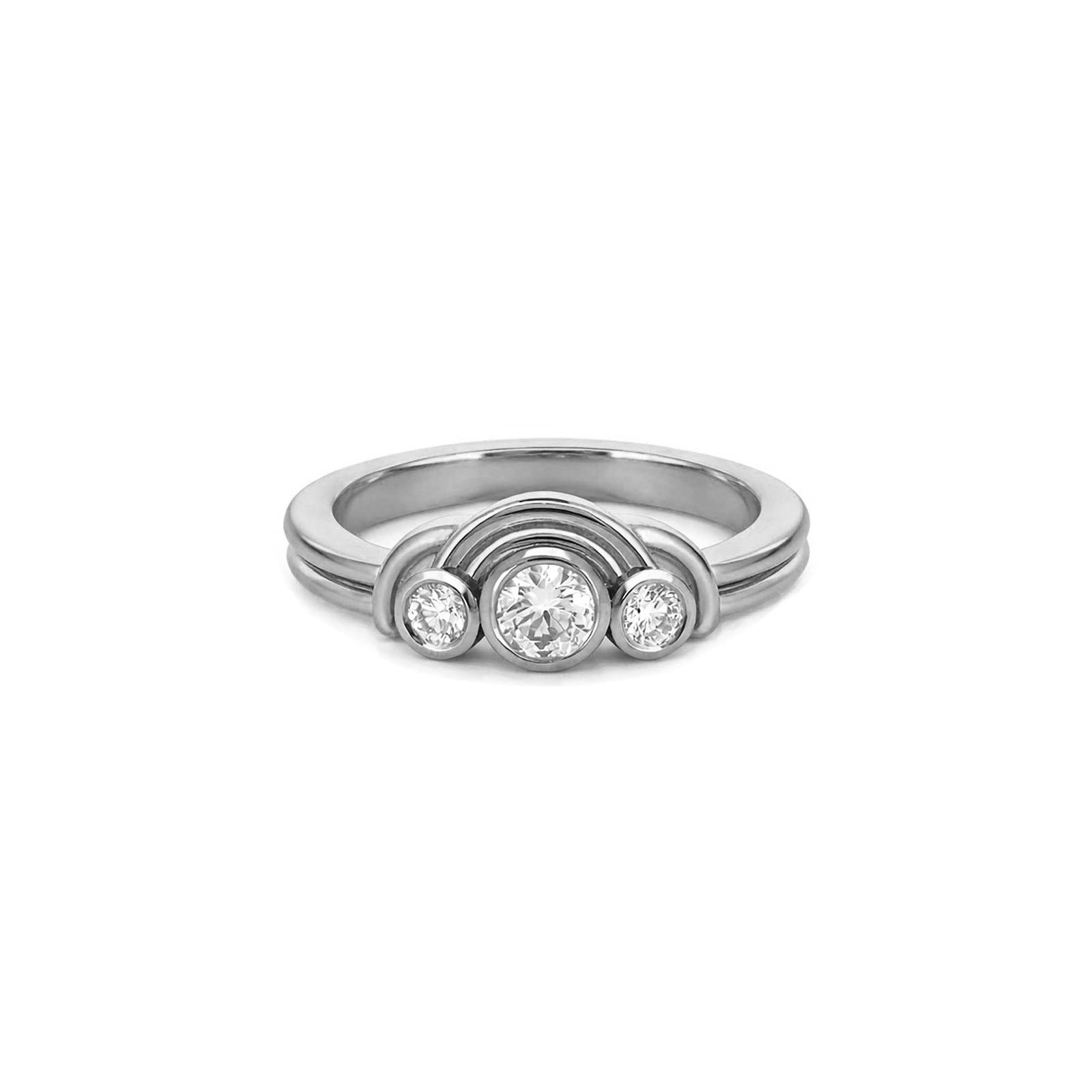 Gold ring with three diamonds on a white background