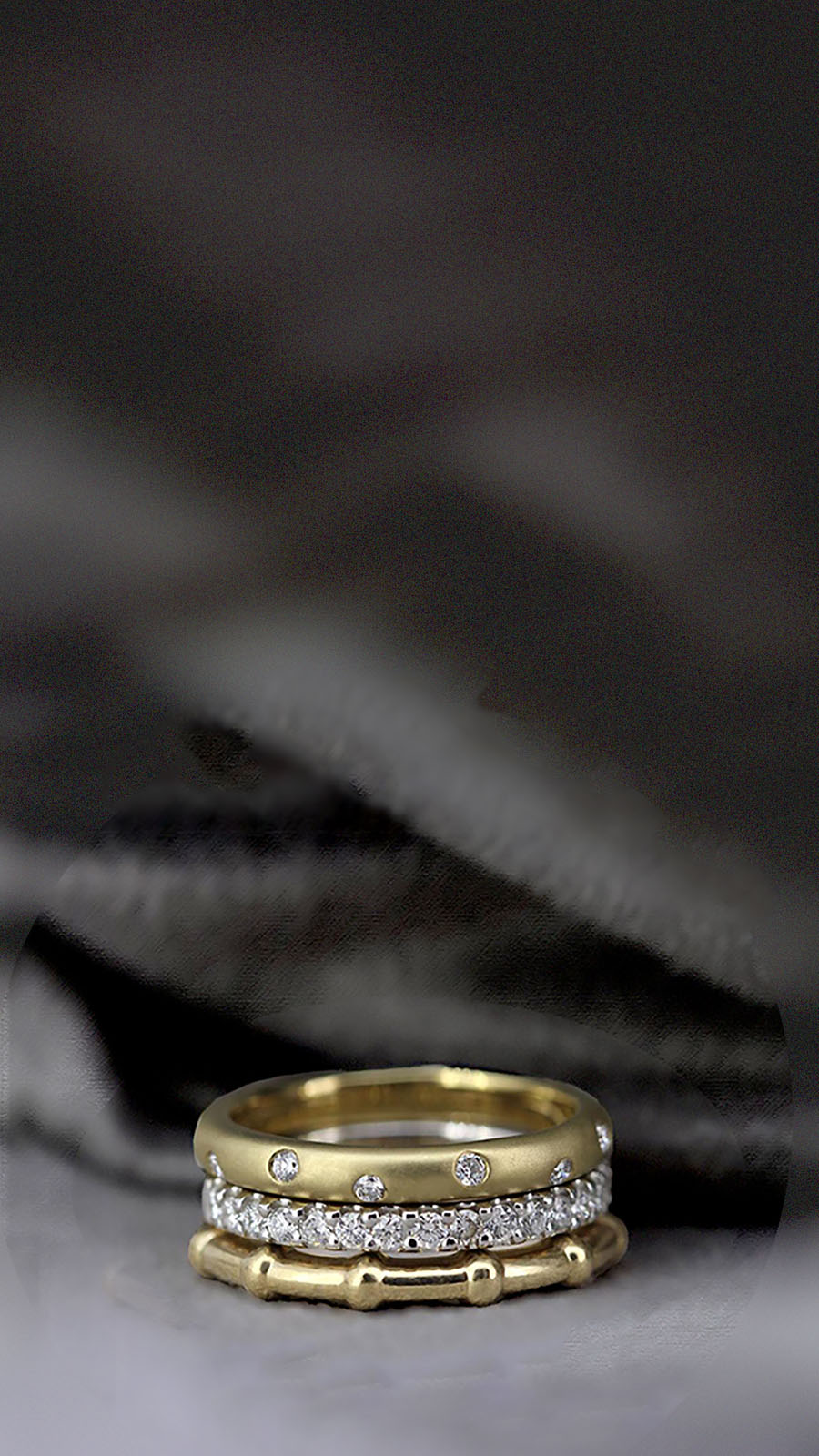 stack of gold and diamond rings  