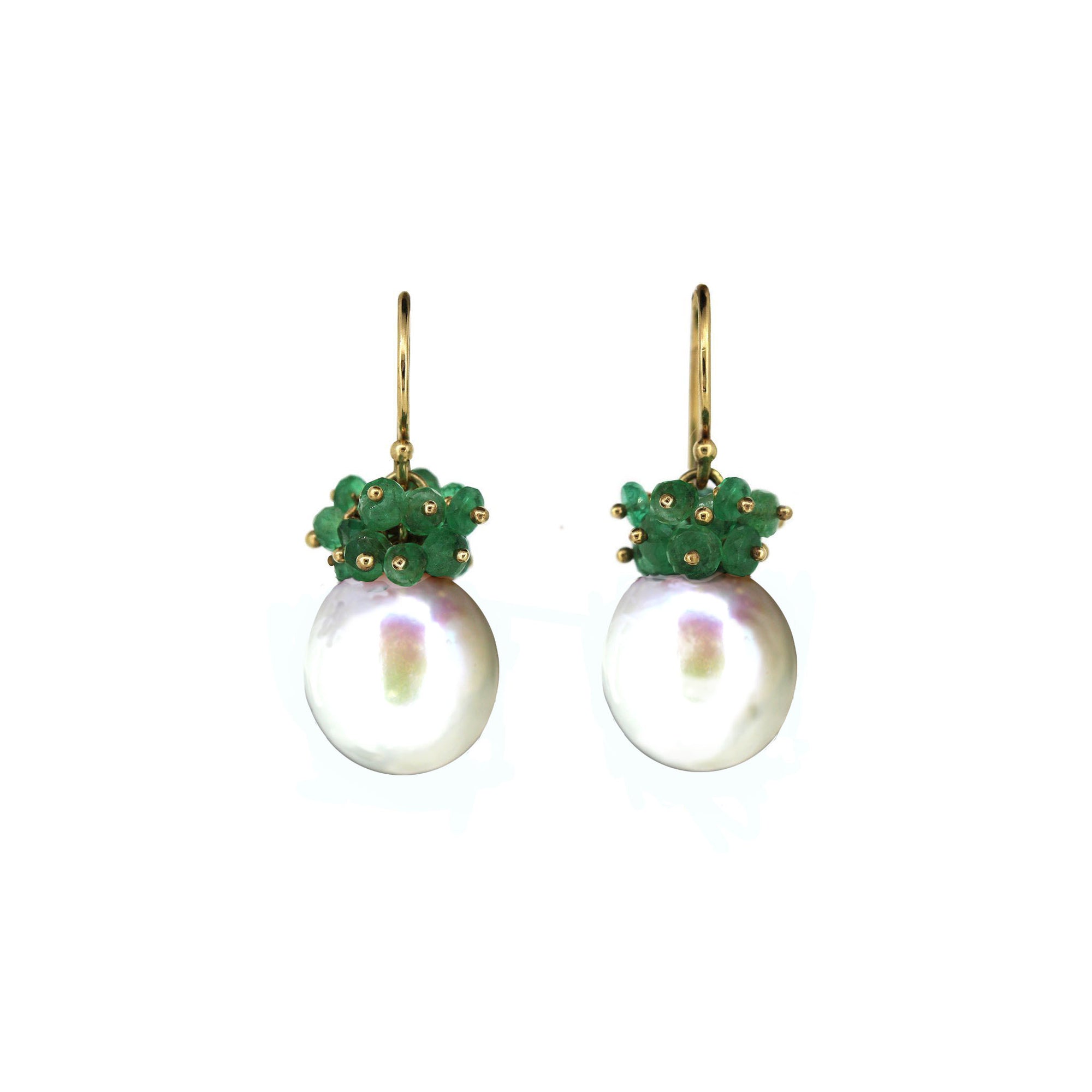 Pair of earrings with green gemstones and pearl-like centers on a white background