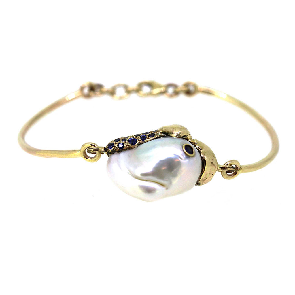 Barnacle pearl Bracelet is inspired by the barnacles on whales. Pearl, sapphire and gold