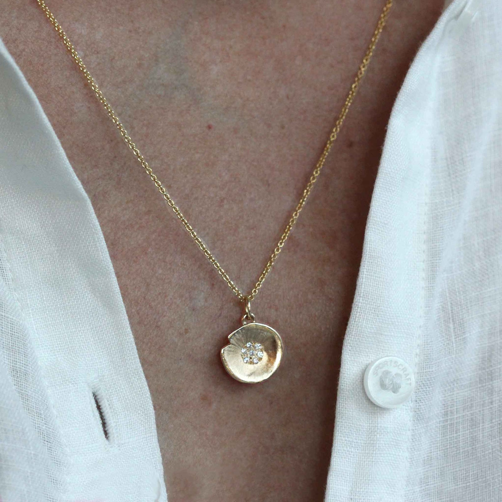 Petite diamond lilypad pendant in yellow gold on chain