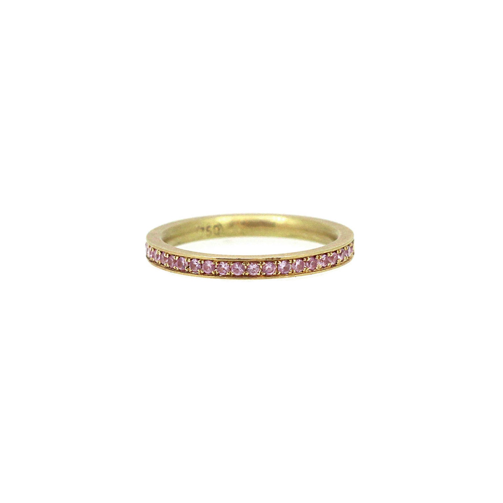 Light pink pave set sapphires in a 2 mm wide yellow gold band