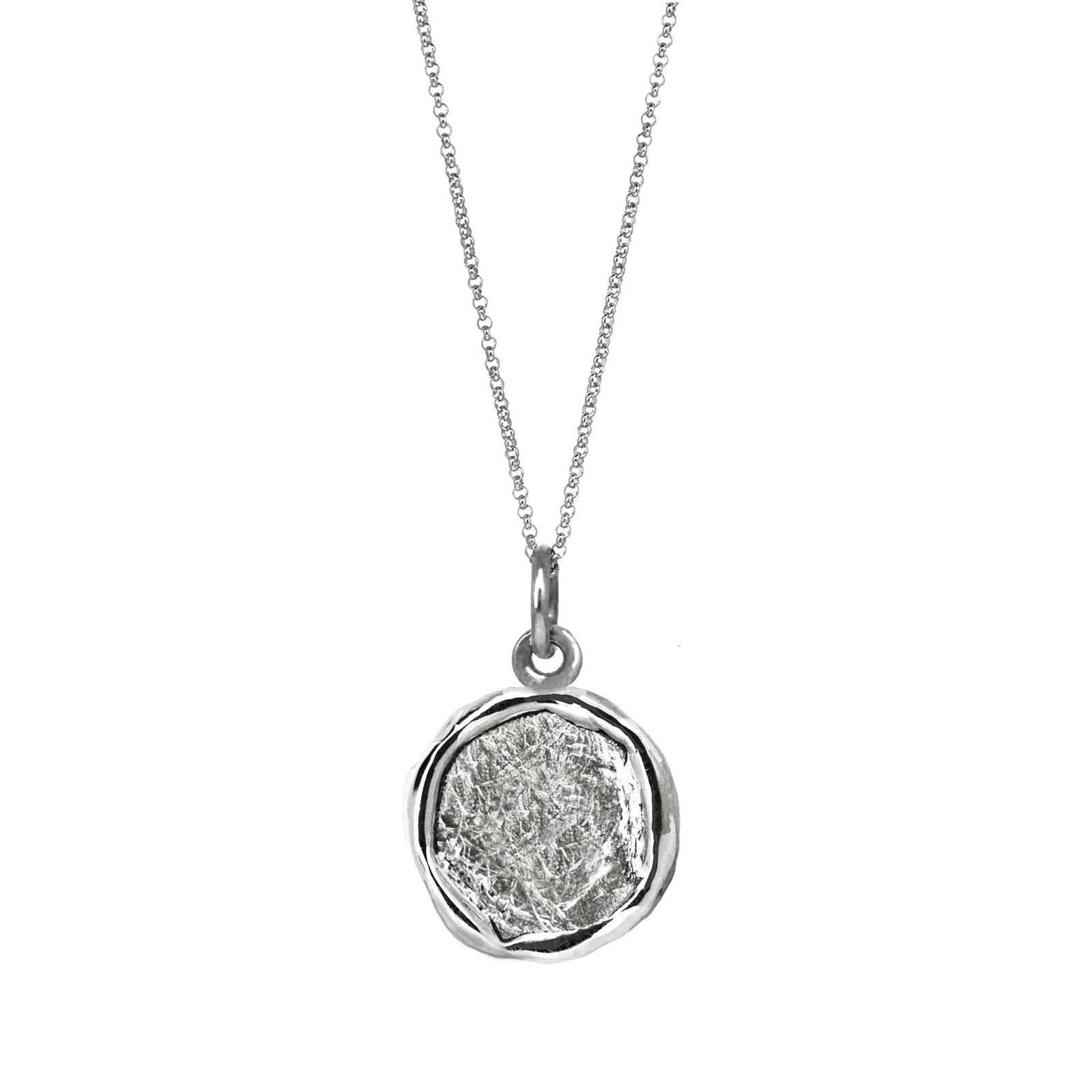 An organic medallion pendant in white gold