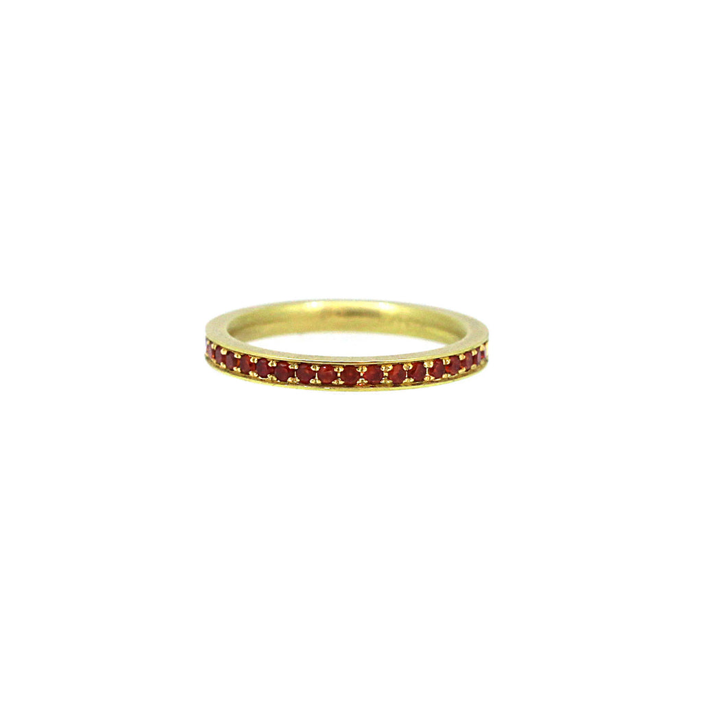 Burnt orange sapphires pave set in yellow gold band