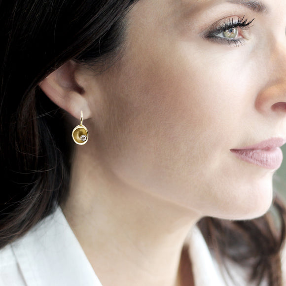 drop gold earrings with single diamond detail