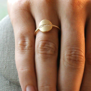 Gold and Diamond cigar ring on model finger