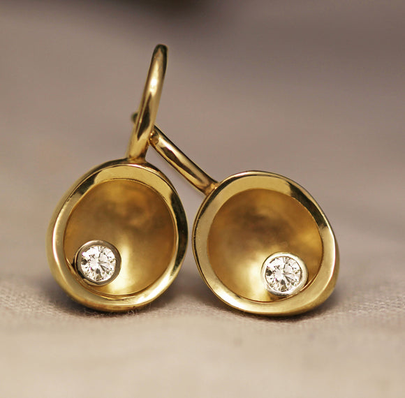 drop gold earrings with single diamond detail