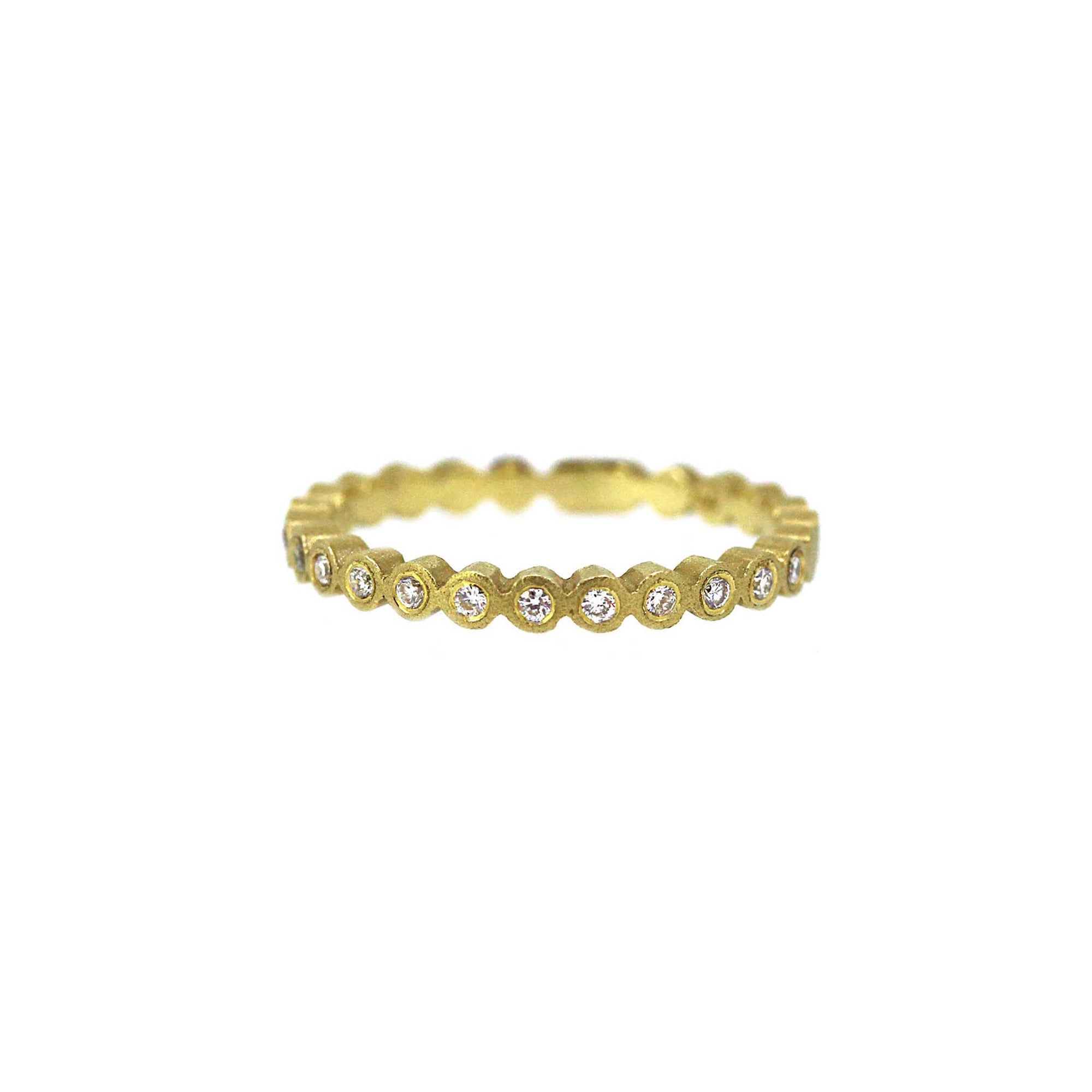 Diamonds set half way around yellow gold band.