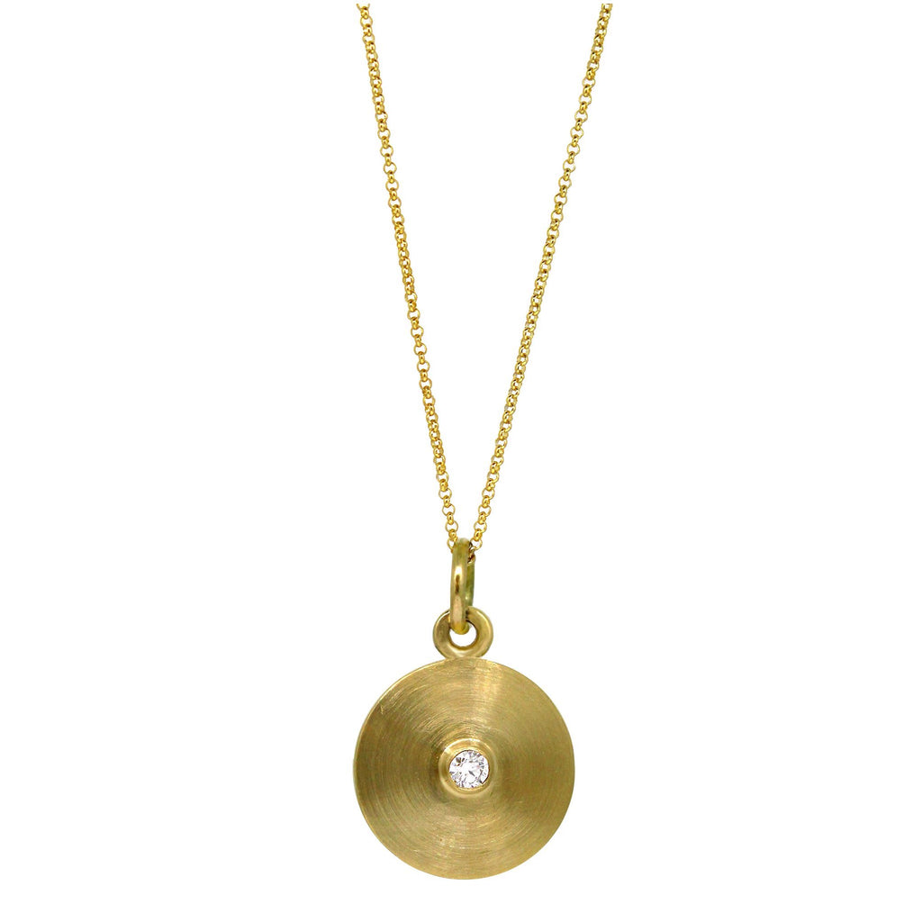 Point diamond pendant on yellow gold chain