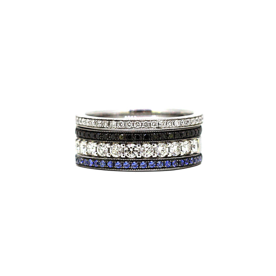 A mixed stack of diamond, black diamond and sapphire rings