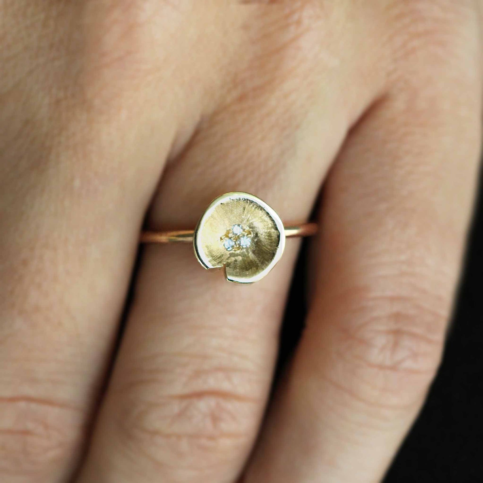 Medium Lilypad ring is one of three. can be worn alone or as a stack . YELLOW GOLD AND DIAMONDS