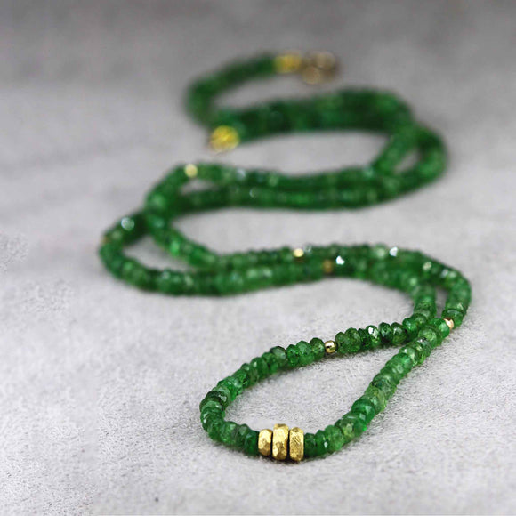Tsavorite bead necklace with gold clasp. this necklace is perfect for layering.