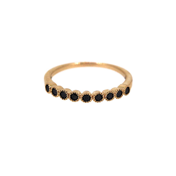 Black diamonds half set on rose gold band with mill grain detail