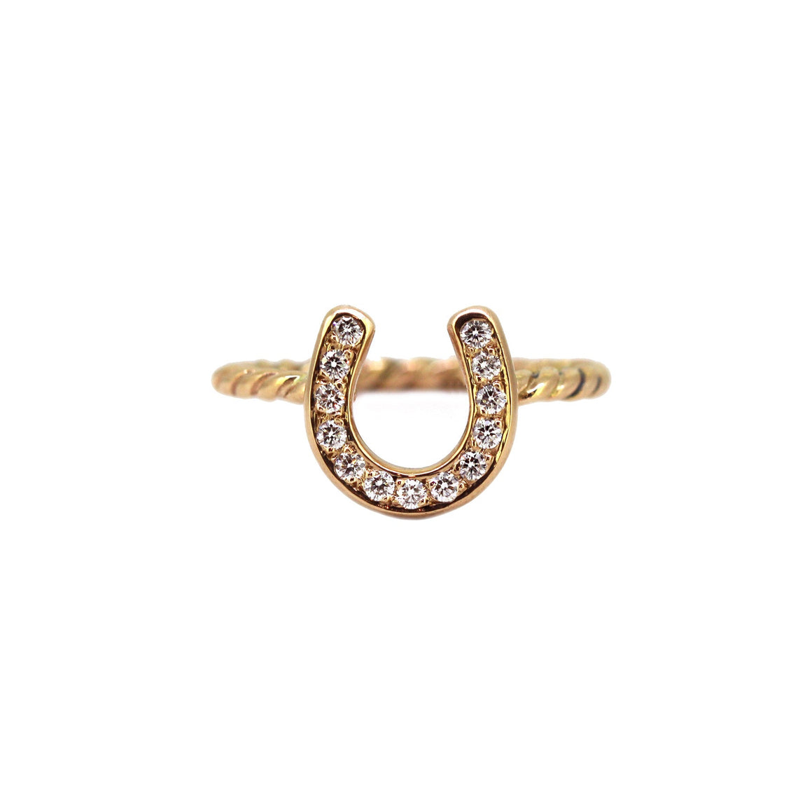 Gold horseshoe ring on a twist pattern band