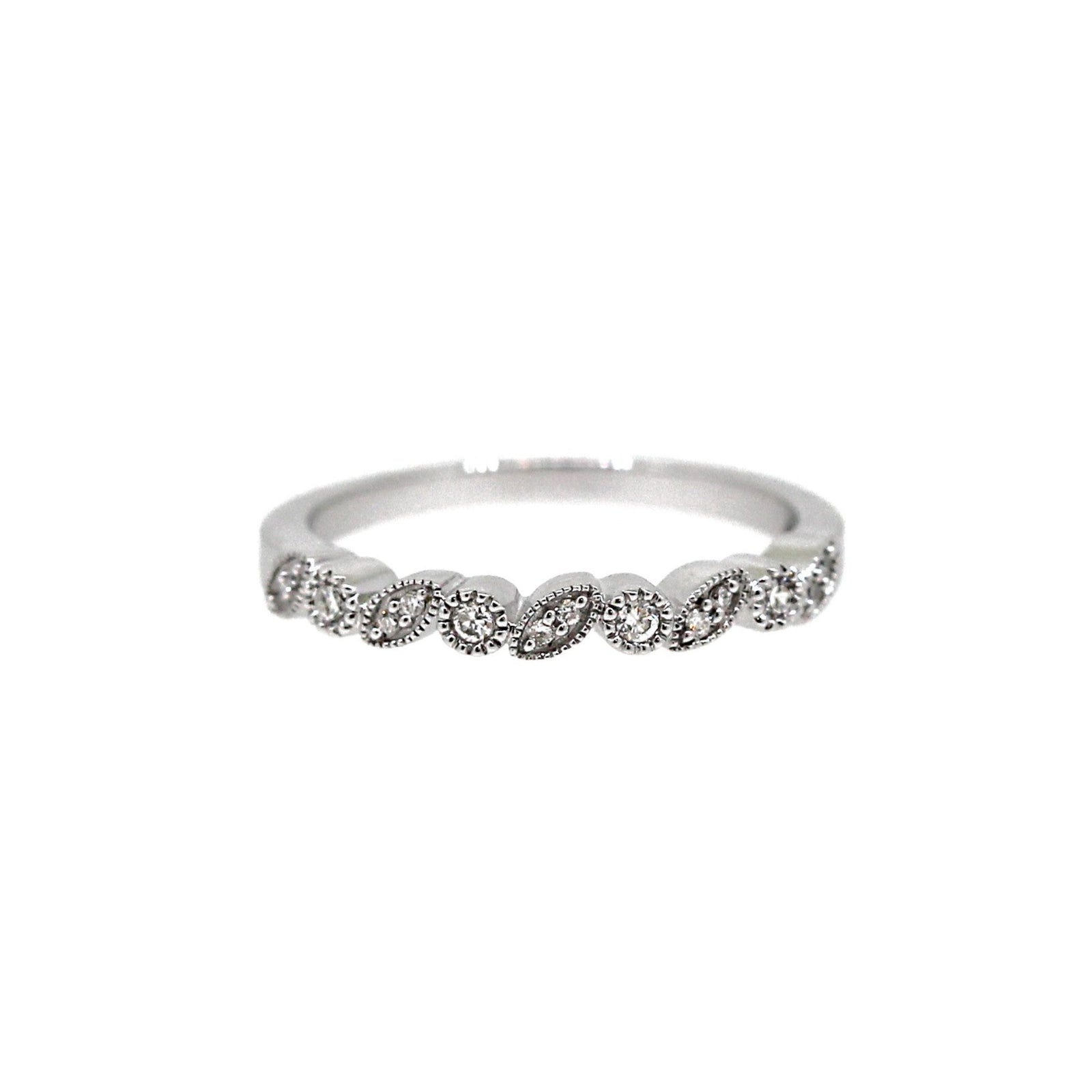 Leaf pattern diamond ring in white gold on white background