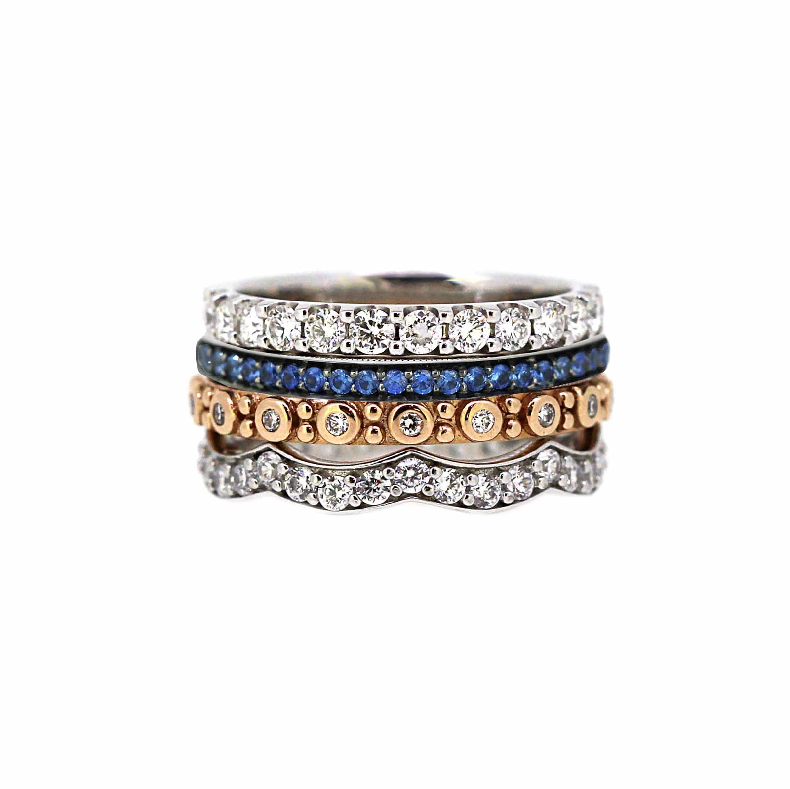 Mixed stack of 4 rings in sapphire and diamonds . bands in white and rose gold