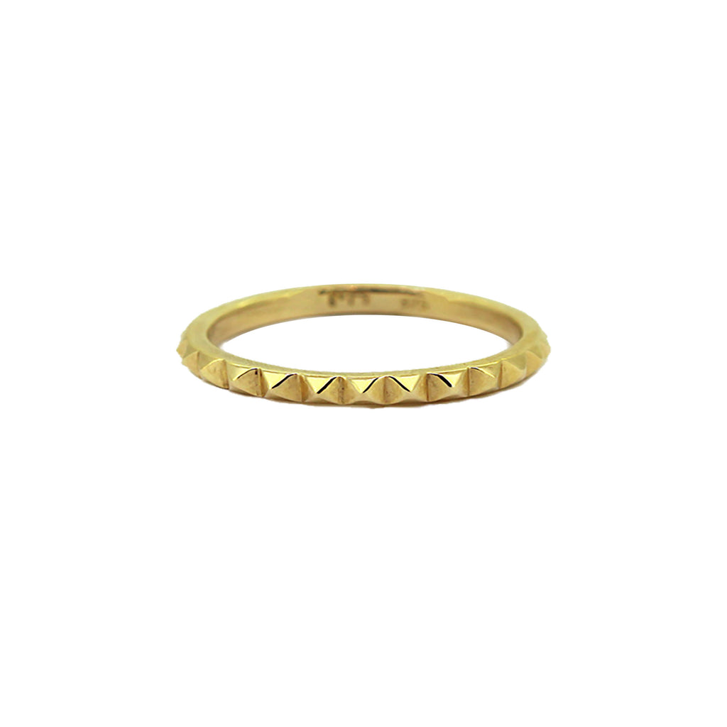 Pyramid stack ring in yellow gold .