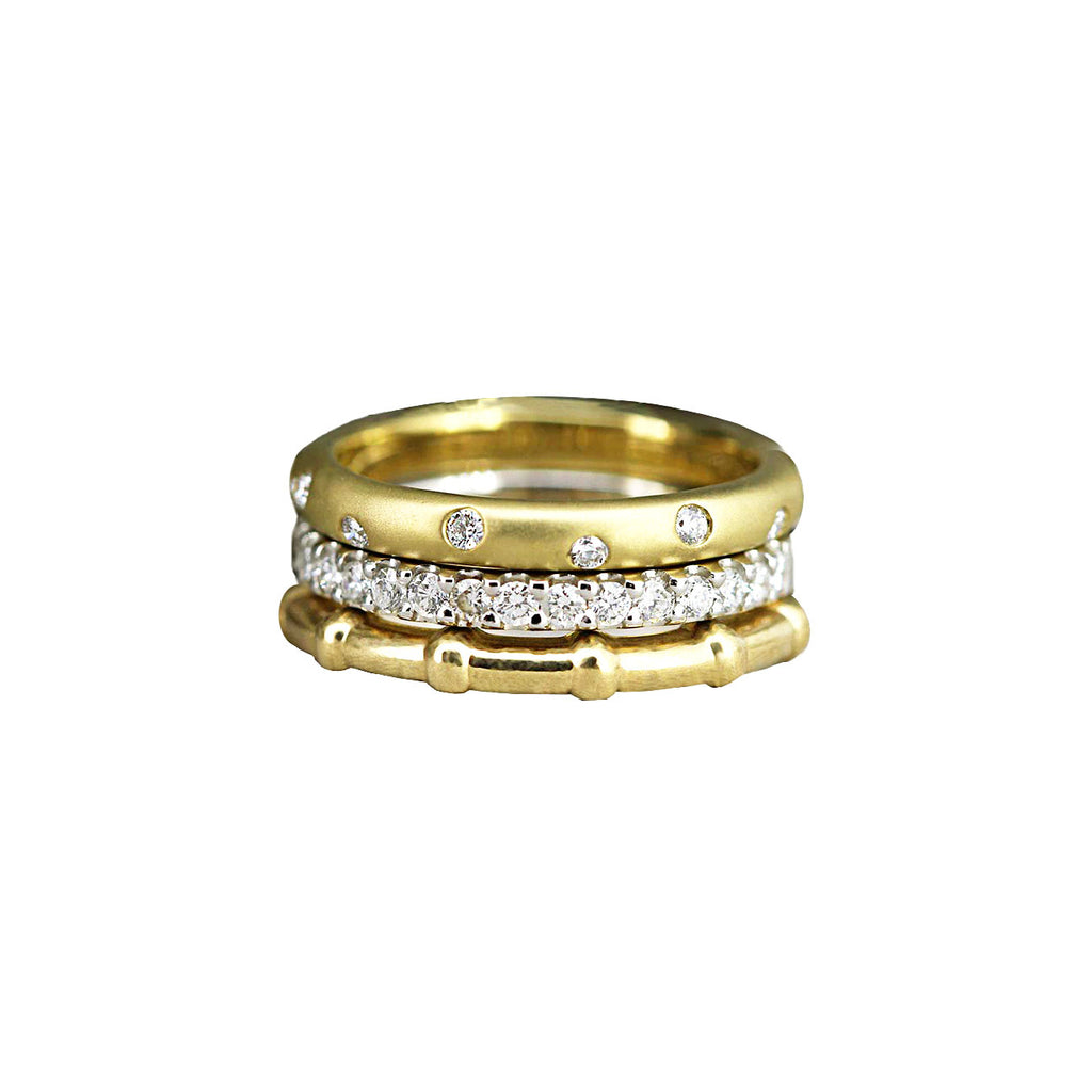 Roma Stack ring is a three ring diamond, white and yellow gold stack